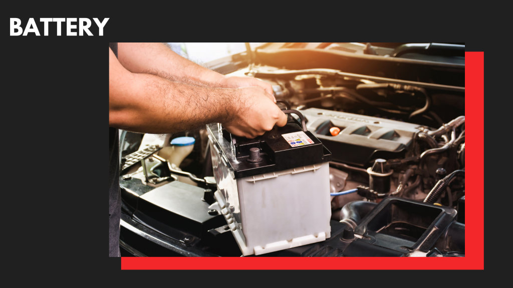 An automotive mechanic installing a new battery.